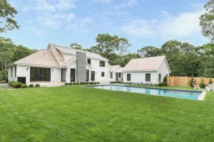 swimming pool in the backyard of a modular home